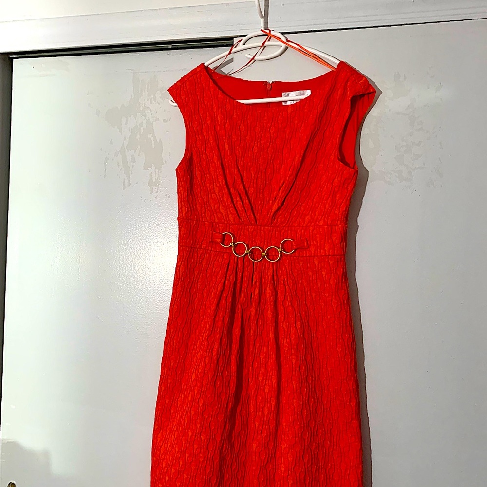 Dress size 8, orange, back zipper, cotton, polyester, spandex, lining, pockets.